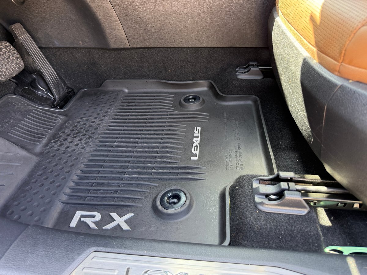 Lexus RX all-weather floor mat with RX and LEXUS branding installed inside a freshly detailed luxury SUV interior